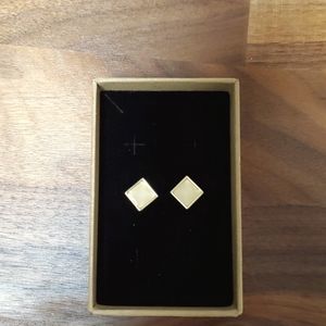 1 pair of gold toned earrings for pierced ears